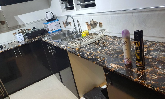 Suva Apartment | Master Bedroom with Shared Kitchen and Living Room